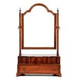 A Queen Anne style walnut dressing table mirror, early 20th c, the moulded arched plate supported on