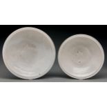 Two graduated South East Asian white glazed porcelain bowls, 19th c or later, in Hong style, the