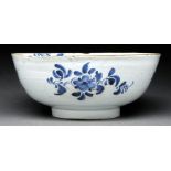 An English Delftware bowl, Lambeth, c1760-70, painted with flowers and trailing foliage, 26.5cm diam