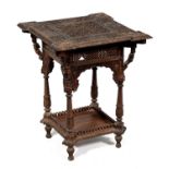 An Anglo Indian bombay black wood carved occasional table, late 19th c,  the square top with