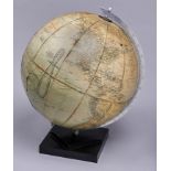 A Philips' 13½" terrestrial globe, Challenge, the sphere covered in paper gores and mounted in