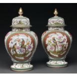 A pair of Continental porcelain jars and covers, 20th c, printed and painted with birds in
