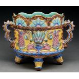 A majolica jardiniere, c1880, the sides moulded with a band of stylised pineapples and foliage on