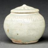 A Chinese Qingbai jarlet and cover, Song dynasty, of typical ovoid shape, the slightly domed cover