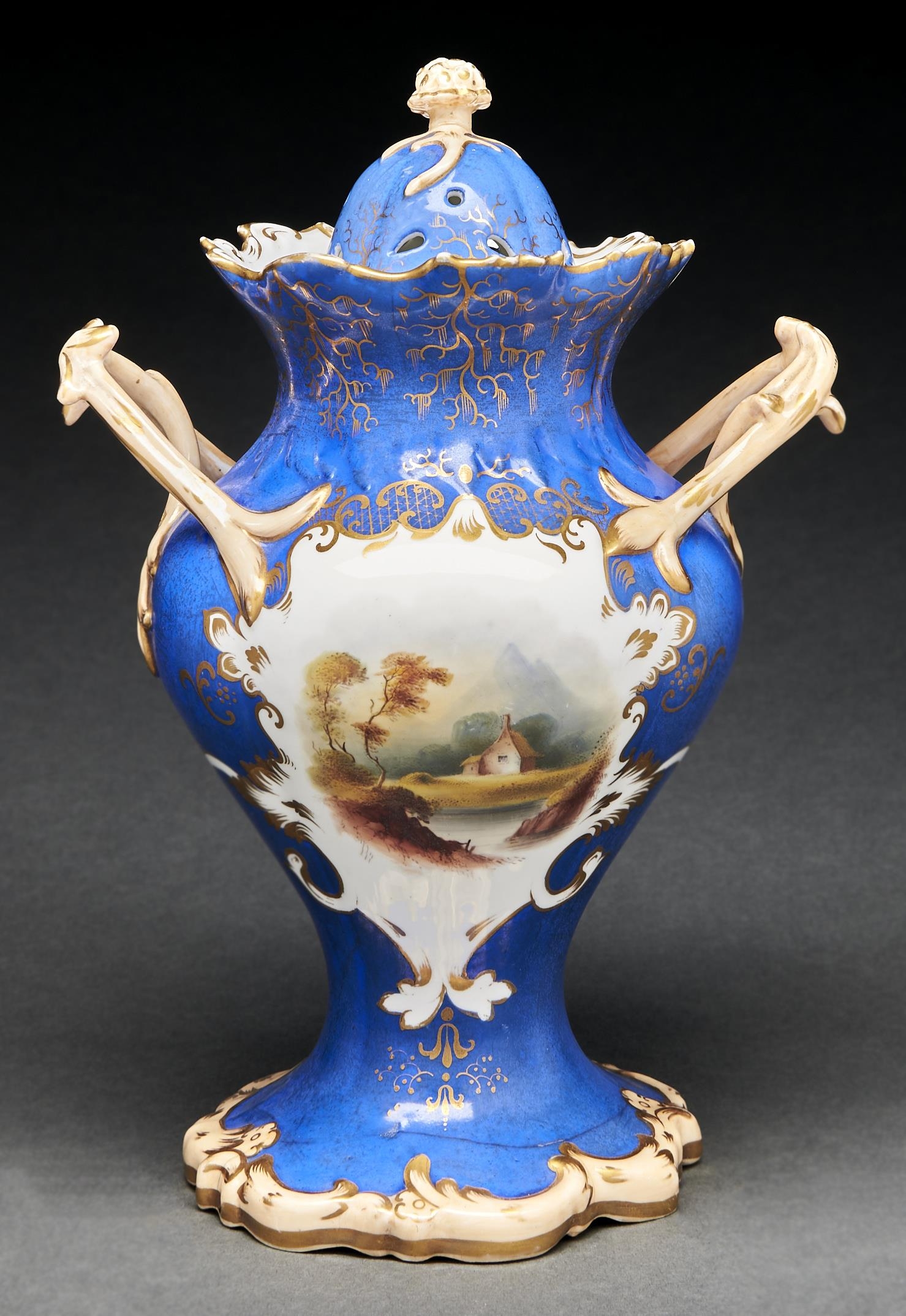 A Staffordshire bone china pourri vase and cover, c1840, with entwined handles and painted with a