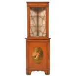 An Edwardian painted satinwood standing corner cabinet, crossbanded in rosewood and line inlaid,