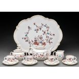 A Royal Crown Derby cabaret set, 1887, the teapot 1900, printed and painted with trailing flowers in