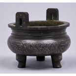 A Chinese bronze shisou tripod censer, 11cm h Good condition