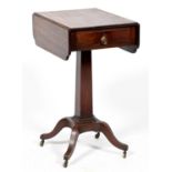 A George IV mahogany  and line inlaid   dropleaf pedestal  table,  the top with re-entrant corners