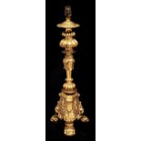 A gilt lacquered metal table lamp in the form of a renaissance three footed candlestick, 46cm h