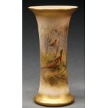 A Royal Worcester spill vase, 1924, painted by Jas Sinton, signed, with pheasants by a waterfall,