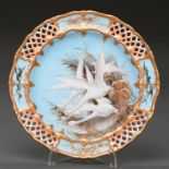 A Royal Worcester plate, 1905, painted by C H C Baldwyn, signed, with swans amidst sepia and