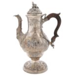 A George III chinoiserie silver coffee pot, of ogee form, chased to either side with figures of a