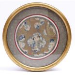 A Chinese embroidered silk and metal thread roundel in woven silk surround, early 20th c, 20.5cm