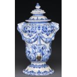 A Dutch Delftware fountain and cover, 18th c, moulded with swags from lion masks and painted in blue