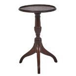 A George IV mahogany tripod table or stand, the moulded top on vase knopped pillar and down curved