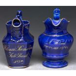 Two Staffordshire cobalt glazed earthenware jugs, dated 1839 and 1842, one with mask spout,