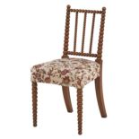 A Victorian bobbin turned satin birch side chair, the stuffed over seat in the original floral