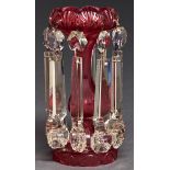 A Victorian cut cranberry glass lustre, with prismatic cut drops and pendants, 21.5cm h Condition