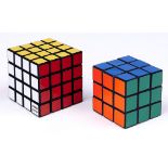 Two Ideal Corp coloured plastic Rubik cubes, 1980 and 1981, both boxed