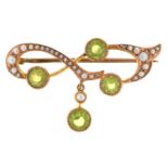 An Edwardian peridot and split pearl bar brooch, in gold and of scrolling form, 37mm, marked 15ct,