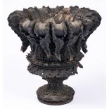 An unusual carved wood vase, probably Indian, late 19th c, pendulous ferns, stylised leaves, 30cm