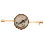 A 9ct gold pin set with a reverse painted crystal intaglio of a hooked fish, early 20th c, 47mm l,