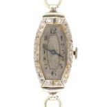 A diamond tonneau cocktail watch, c1930, with oval dial and movement, in platinum, 16 x 27mm, on