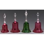 Four Victorian cranberry or green glass ornamental bells, 29-33cm h Condition ReportGood