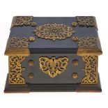 A Victorian gilt brass mounted ebony jewel casket, the pierced and engraved mounts and studs to