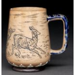 A Doulton ware mug, 1879, decorated by Hannah B Barlow with a continuous scene of deer, 10cm h,