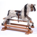 A painted wood rocking horse, in early 20th c style, 88cm h Condition ReportGood condition with only