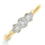 A three stone diamond ring, gold hoop marked 18ct PT, 2.5g, size H Condition ReportSlight wear