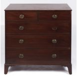 A George III mahogany chest of drawers, having oak lined drawers, the oval brass handles original,