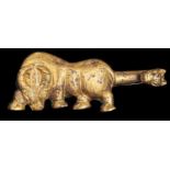 A Chinese gilt bronze belt hook, Han dynasty - six dynasties, in the form of an ox, the creatures