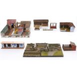 A collection of model farm and other buildings, c1930-50's, painted wood, two with thatched roof and