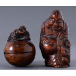 A Japanese boxwood netsuke, of Hotei and a karako boy and a smaller boxwood okimono, 19th c and