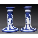 A pair of William Adams & Co dark blue jasper dip candlesticks, c1900, sprigged with classical