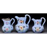 Three William Ridgway blue stoneware jugs, c1835, enamelled with colourful flowers and gilt, one