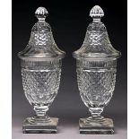 A pair of shield shaped cut glass sweetmeat vases and covers, late 19th c, in Regency style, 24cm