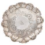 A George II silver waiter, later chased, crested, the underside engraved GR Brigstocke Ryde 1904,