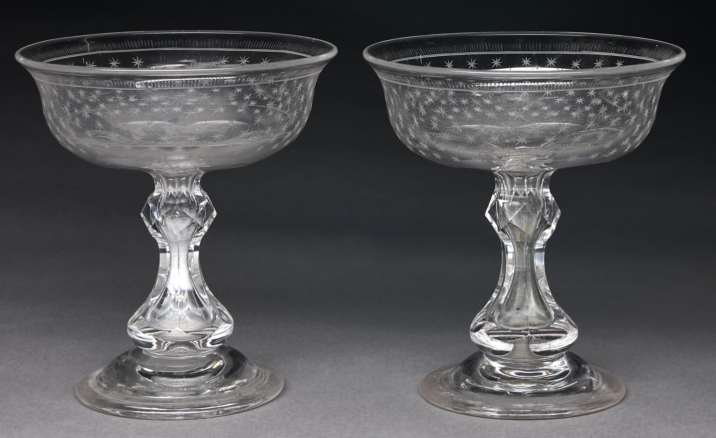 A pair of Victorian glass sweetmeat stands, c1860, the bowl engraved with stars, on faceted baluster