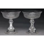 A pair of Victorian glass sweetmeat stands, c1860, the bowl engraved with stars, on faceted baluster