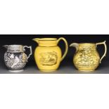 An English bat printed yellow ground earthenware jug, a yellow ground silver resist lustre ware