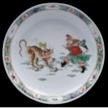 A Chinese famille verte dish, 19th c, enamelled with a ferocious tiger and equally ferocious man,