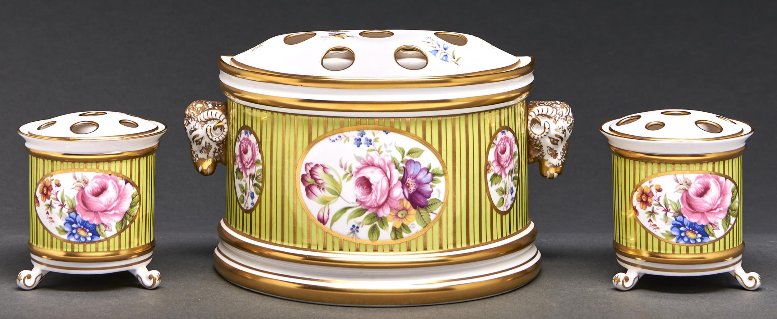 A Lynton bough pot and cover and pair of matching vases, late 20th c, decorated with flowers on a