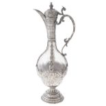 A Continental silver mounted wrythen fluted glass claret jug, late 19th c, of Persian inspiration,