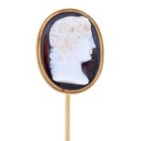 A hardstone cameo, 19th c, of onyx, carved with the head of Venus, mounted in a gold stick pin, head