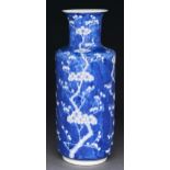 A Chinese blue and white rouleau vase, Qing dynasty, 19th c, painted with prunus on a cracked ice