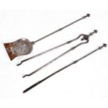 A set of three early Victorian burnished steel fire irons, the baluster handle with faceted pommel